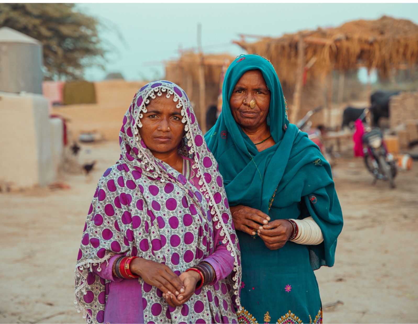 Two women at a water point in the Thar desert, Pakistan